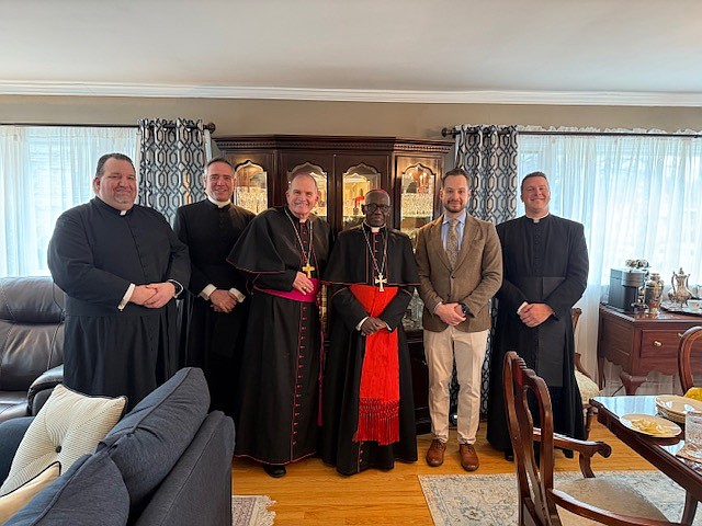 From left, Father Michael Hall, pastor, St. Gregory the Great Parish, Hamilton Square; Father Brian Woodrow, pastor, St. Dominic Parish, Brick; Bishop David M. O'Connell, C.M.; Cardinal Sarah; Peter Carter, and Father Christopher Dayton, pastor, St. Paul Parish, Princeton, gather for a photo Nov. 23 in St. Paul Parish rectory. Staff photo