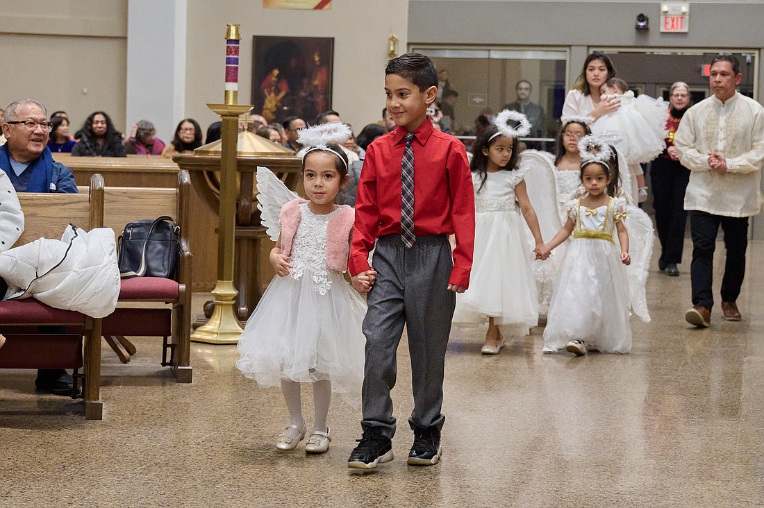 Young Filipino parishioners participate in a closing Simbang Gabi Mass in this 2024 file photo. Parishes around the Diocese have announced their celebrations for 2025. Mike Ehrmann photo