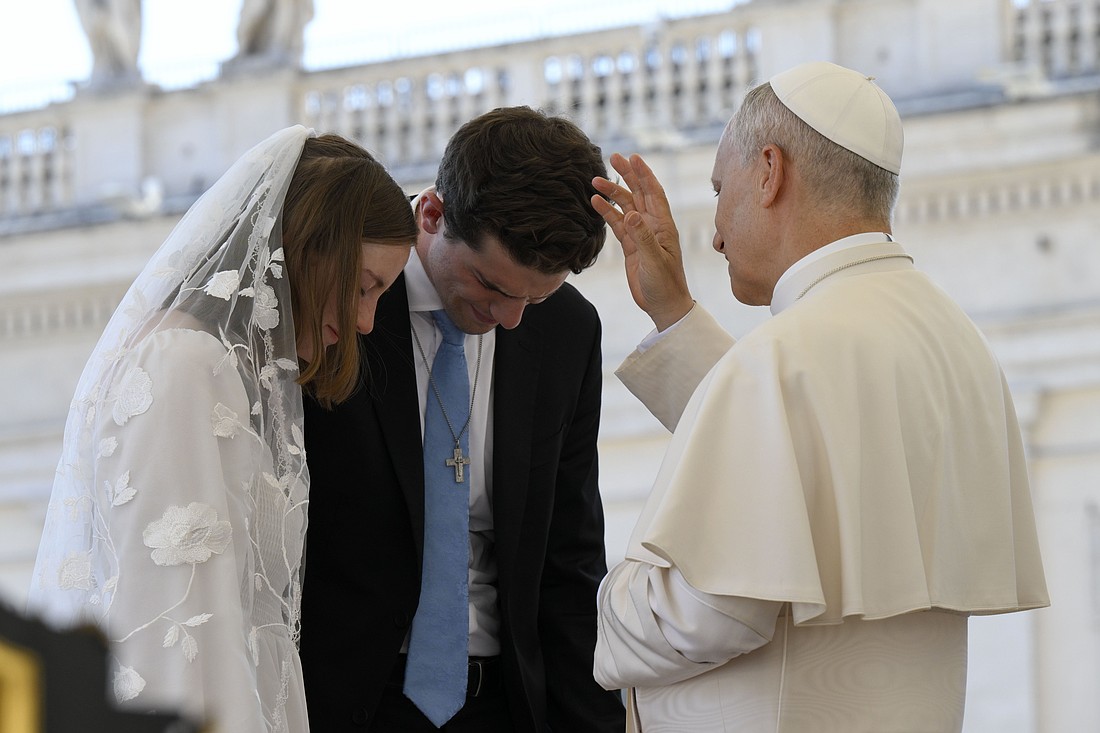 Pope Leo XIV blesses a newlywed couple at the end of his general audience Aug. 6, 2025, in St. Peter's Square at the Vatican. (CNS photo/Vatican Media)