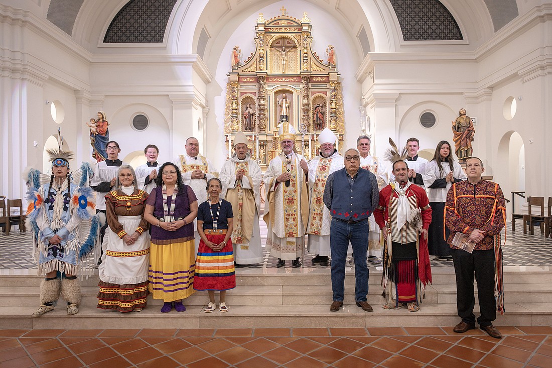 Archbishop Paul S. Coakley, center, Benedictine Abbot Lawrence Stasyszen of St. Gregory's Abbey in Shawnee, Okla., at right of the archbishop, Benedictine Abbot Philip Anderson of Our Lady of Clear Creek Abbey in Hulbert in the Diocese of Tulsa, Okla., at left, stand with Deacon Roy Callison and Deacon Craig Victor, altar servers and lectors after the Native American Mass on Nov. 23, 2025, at the Blessed Stanley Rother Shrine in Oklahoma City. (OSV News photo/Chris Porter, Sooner Catholic).