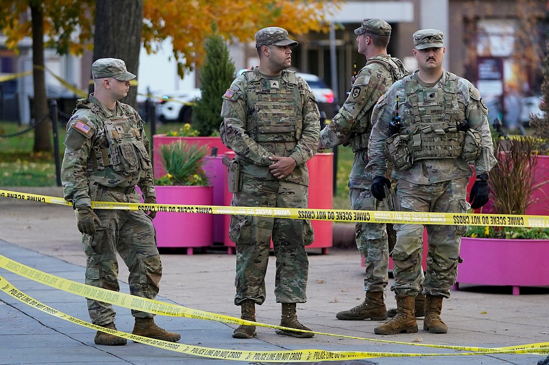 National Guard members stand in a cordoned-off area after two others were shot near the White House in Washington Nov. 26, 2025. The two who were shot were hospitalized in critical condition, FBI Director Kash Patel and Washington Mayor Muriel Bowser told reporters. (OSV News photo/Nathan Howard, Reuters)