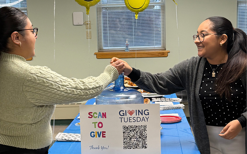 Chancery staffers, Llian Juan and Belem Perez, make a donation Dec. 2, Giving Tuesday. The Chancery staff donated over $500 in support of Catholic education in the Diocese of Trenton on the national day of giving. Staff photo.