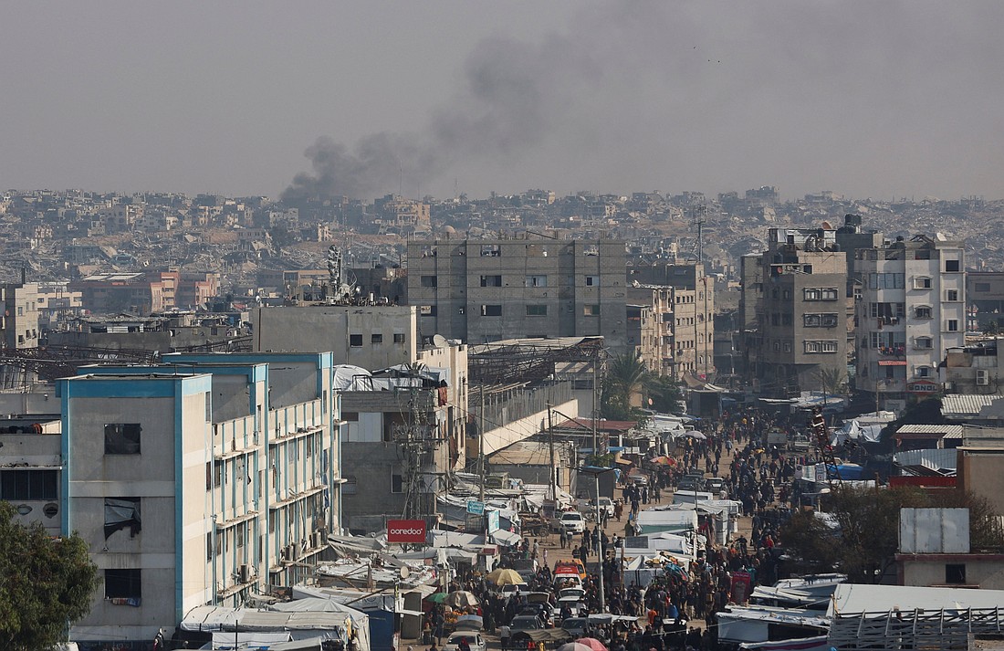Smoke rises in an area within the so-called "yellow line" in Khan Younis in the southern Gaza Strip Nov. 18, 2025, an area Israeli troops withdrew to under the ceasefire. Displaced Palestinians are seen sheltering in tents. (OSV News photo/Ramadan Abed, Reuters)
