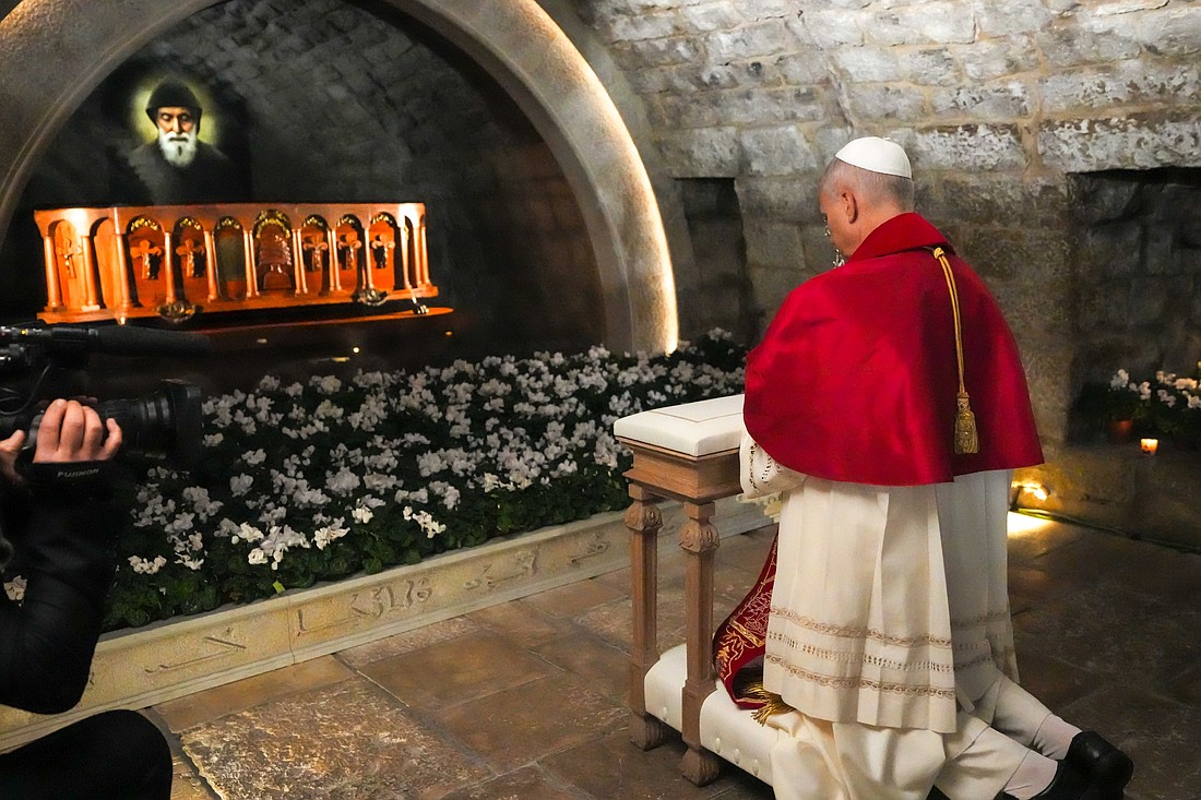Pope Leo XIV prays in silence before the tomb of St. Charbel Makhlouf at the Monastery of St. Maron in Annaya, Lebanon, Dec. 1, 2025. (CNS photo/Lola Gomez)
