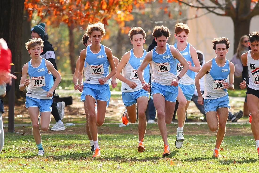 The CBA cross country runners head out to the Holmdel Park course at the start of the Meet of Champions. Photo by Larry Levanti/https://larrylevanti.com