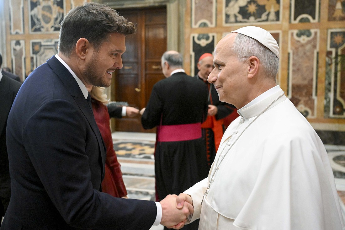 Pope Leo XIV greets Canadian singer Michael Bublé after an audience Dec. 5, 2025, in the Apostolic Palace with the performers and organizers of the Vatican Christmas concert for the poor. (CNS photo/Vatican Media)