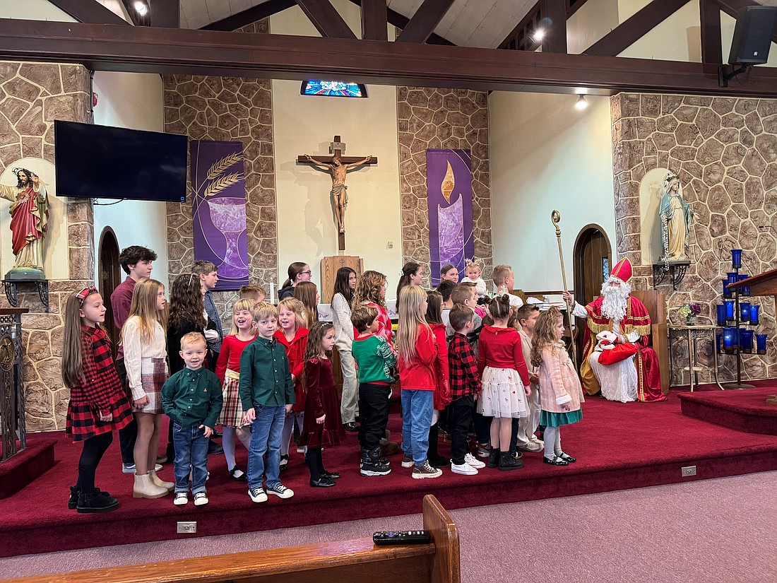 The children line up for a visit with St. Nicholas Dec. 6 in St. Michael Church, Trenton.