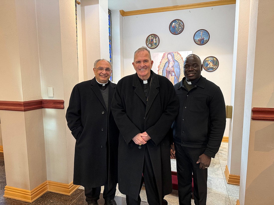 Bishop O'Connell is pictured with Msgr. Thomas Gervasio, left, and Father Jean Felicien following the Mass celebrated in Our Lady of Sorrows Church, Hamilton, for the Solemnity of the Immaculate Conception of the Blessed Virgin Mary on Dec. 8. Staff photo