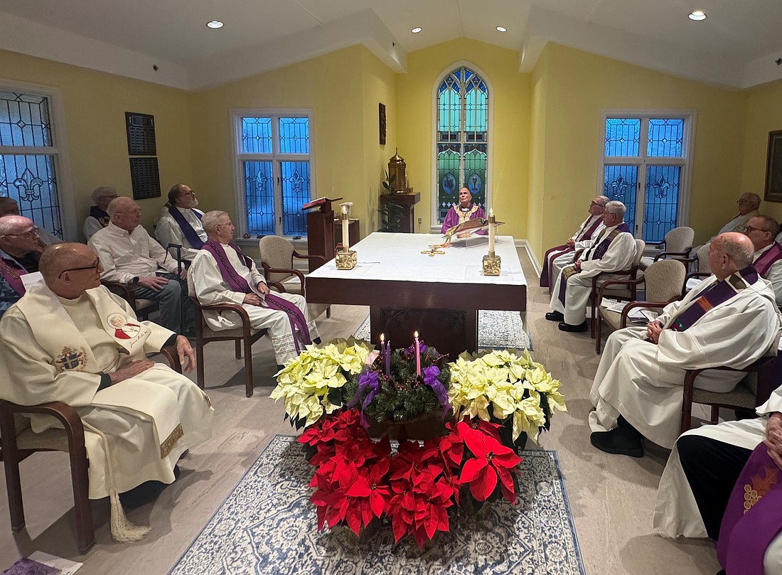 Bishop O'Connell and the retired priests living in Villa Vianney, Lawrenceville, gather for Mass Dec. 9. Staff photo