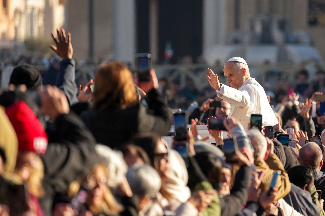 Pope Leo XIV greets visitors and pilgrims from the popemobile as he rides around St. Peter's Square at the Vatican before his weekly general audience Dec. 10, 2025. (CNS photo/Lola Gomez)