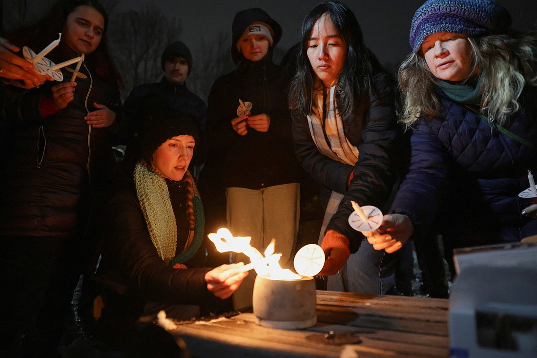 People attend a candlelight vigil at Lippitt Memorial Park in Providence, R.I., Dec. 14, 2025, following a mass shooting at Brown University. The shooting left two students dead and nine others injured at the Ivy League school, where classes and exams have been canceled. (OSV News photo/Kylie Cooper, Reuters)