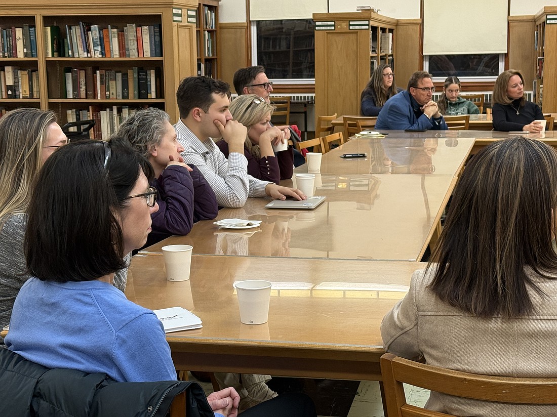 Parents and students listen intently to Dr. Snell's points about A.I. in the library of Notre Dame High School, Lawrenceville. EmmaLee Italia photos