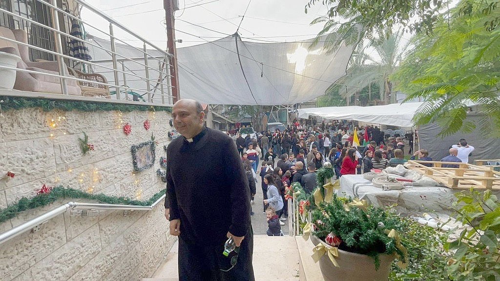 Father Gabriel Romanelli, pastor of Gaza City's Holy Family Parish, is pictured in the church compound Dec. 19, 2025, as he welcomes Cardinal Pierbattista Pizzaballa, the Latin Patriarch of Jerusalem, making his pre-Christmas pastoral visit to the parish. (OSV News/courtesy Latin Patriarchate of Jerusalem)