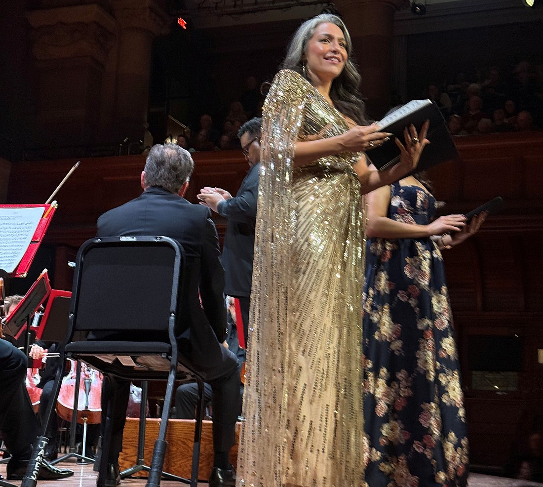 One of the Messiah vocalists smiles as she looks out at the audience.