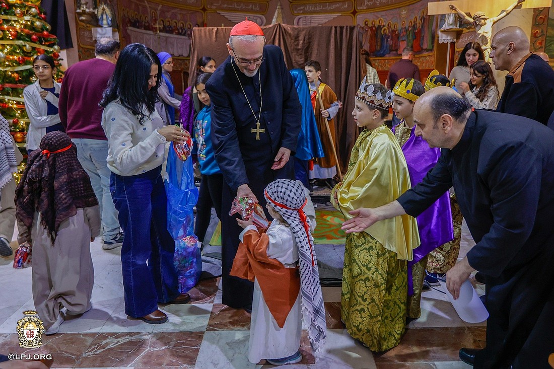 Cardinal Pierbattista Pizzaballa, Latin patriarch of Jerusalem, distributes Christmas gifts to children at Holy Family Church in Gaza City Dec. 20, 2025, during his Christmas pastoral visit. He arrived prior to Christmas in a sign of closeness with a community that endured two years of war. (OSV News/courtesy Latin Patriarchate of Jerusalem)