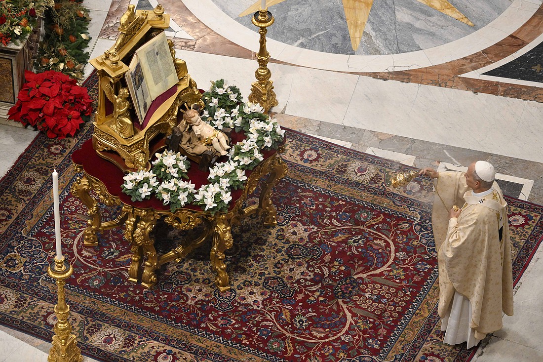 Pope Leo XIV uses incense to bless a statue of the baby Jesus at the beginning of Christmas morning Mass in St. Peter's Basilica at the Vatican Dec. 25, 2025. (CNS photo/Vatican Media)