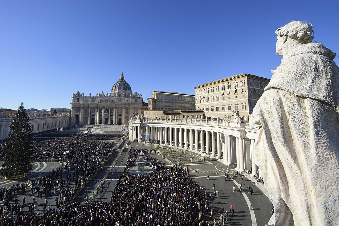 Visitors gather in St. Peter's Square at the Vatican as Pope Leo XIV leads the Angelus prayer on the feast of the Holy Family, Dec. 28, 2025. (CNS photo/Vatican Media)