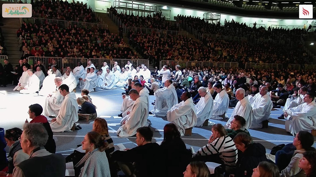 A screen grab shows brothers of the Taizé ecumenical community and young adults from throughout Europe holding their evening prayer service at Stozice Arena in Ljubljana, Slovenia, Dec. 28, 2023. (CNS photo/Taize, via YouTube)