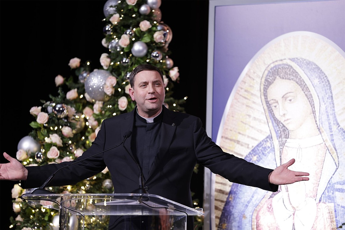 Msgr. James P. Shea, president of the University of Mary in Bismarck, N.D., speaks next to an image of Our Lady of Guadalupe after accepting the Christ Brings Hope Award at the 25th anniversary party for Relevant Radio in Chicago Dec. 12, 2025. (OSV News photo/Relevant Radio)