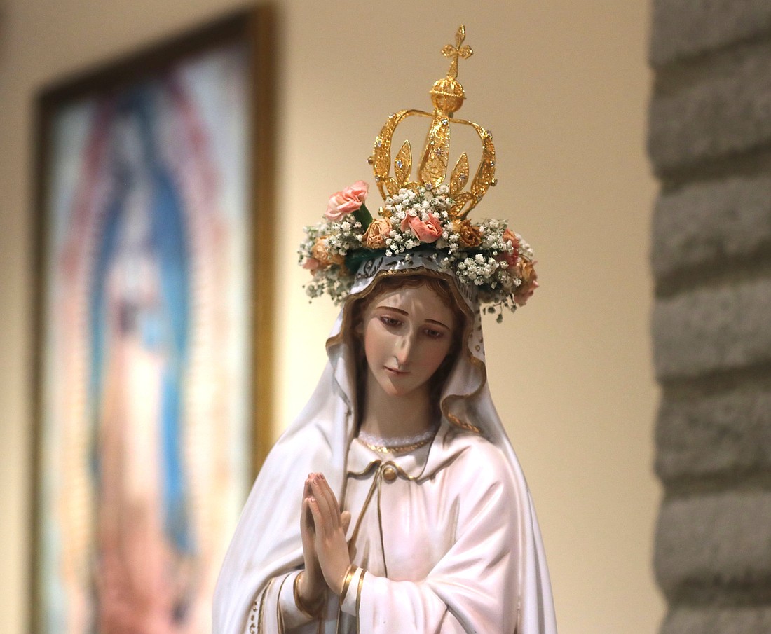 A statue of Mary with a crown, and a painting of Our Lady of Guadalupe are pictured at Sacred Heart Church in Prescott, Ariz., May 5, 2025. (OSV News photo/Bob Roller)