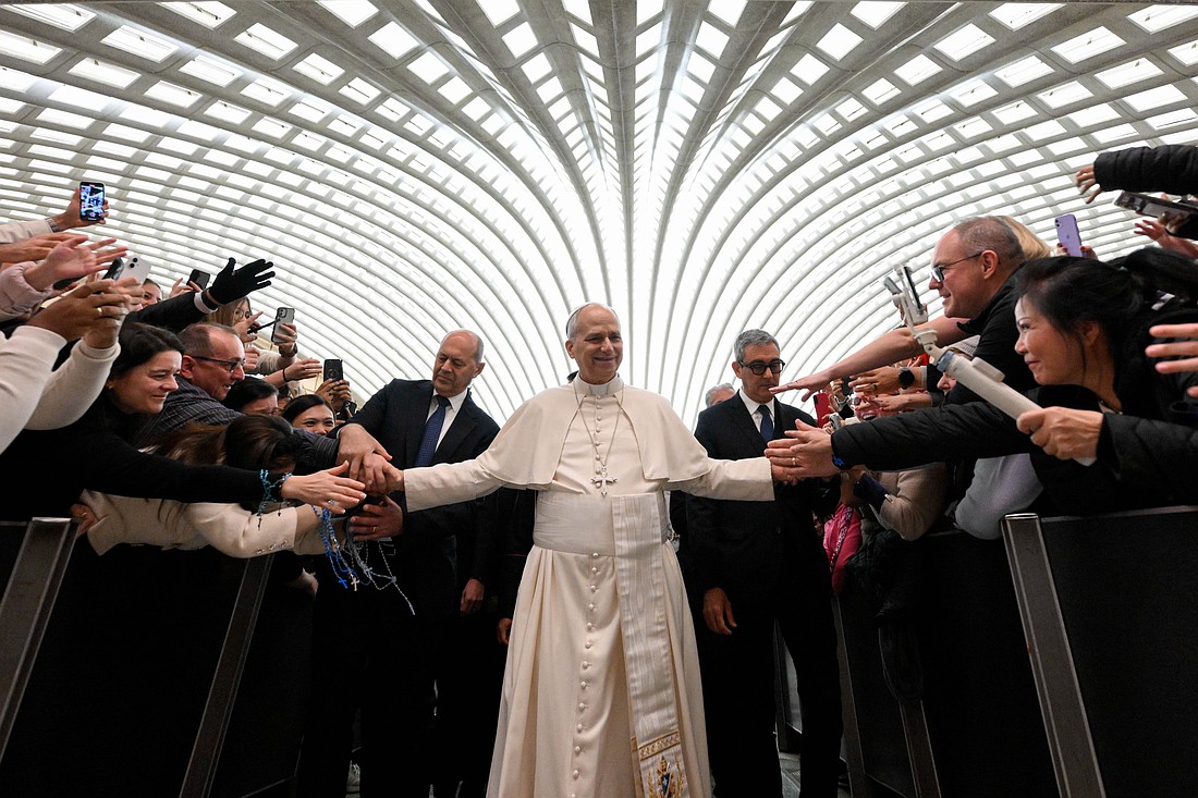 Pope Leo XIV greets people at the conclusion of his weekly general audience in the Paul VI Audience Hall at the Vatican Jan. 7, 2026. (CNS photo/Vatican Media)