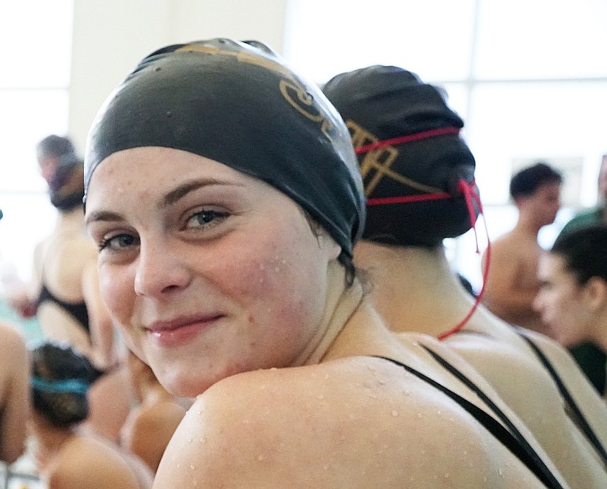 Despite the pressure and tension of a swim meet, Katie Buffalino has time to flash a smile in the midst of a meet, as she swims mostly for fun. Courtesy photo