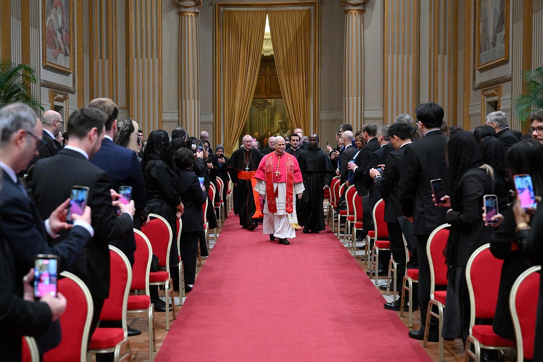 Pope Leo XIV walks down the aisle to meet with members of the diplomatic corps accredited to the Vatican at the Apostolic Palace at the Vatican Jan. 9, 2026. (CNS photo/Vatican Media)