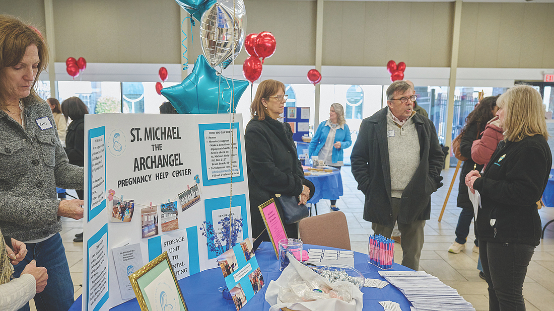 The January 2025 EXPO in St. Robert Bellarmine Co-Cathedral Parish hall featured an array of exhibits with information and resources on pro-life efforts and ministries. Mike Ehrmann photo