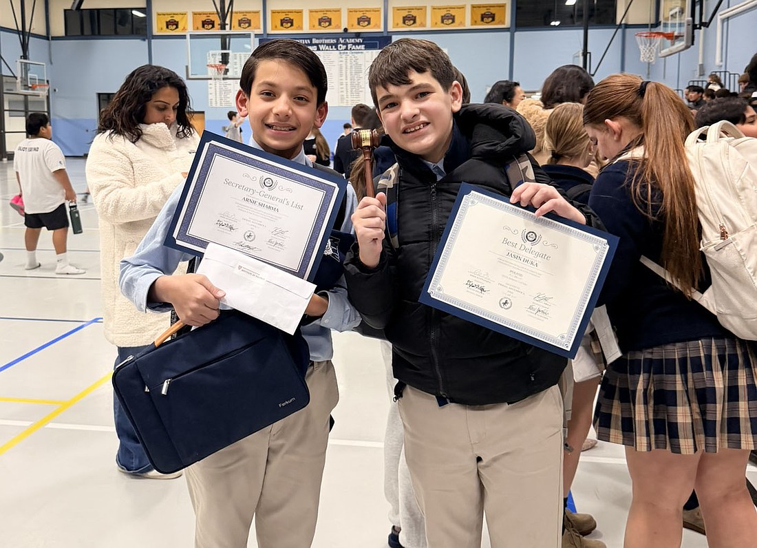 Holding their certificates are St. Benedict School students Arnie Sharma, left, who received the Secretary General's List, and Jasin Duka, who was honored as Best Delegate during the CBA MiddleMun Conference recently held in Christian Brothers Academy, Lincroft. Courtesy photo