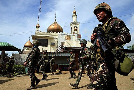 Gunmen take Catholic hostages; Philippines' Duterte imposes martial law