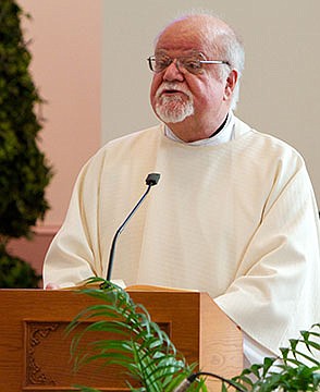 Father John Wake  transitions to retirement