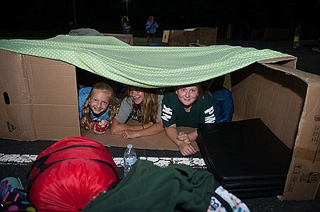Young teens spend night in cardboard boxes during lesson on homelessness