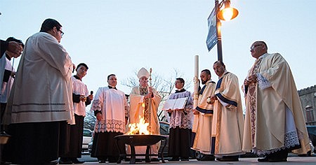 At Easter Vigil, Bishop O'Connell preaches on the promise of the Messiah; new members celebrated