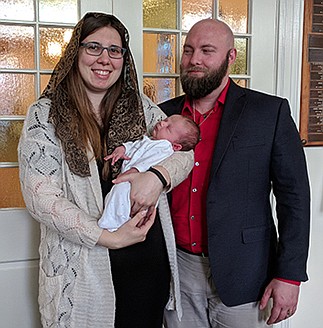 New mother enters Church days after son is born