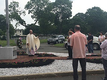During Memorial Day Mass, faithful remember dearly departed, offer prayers for peace in the world