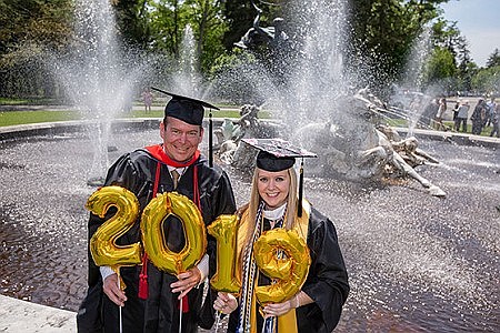 Father and daughter share in college graduation joy