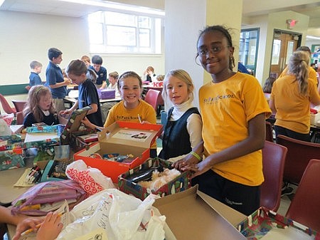 St. Paul School marks 10 years of Christmas smiles  