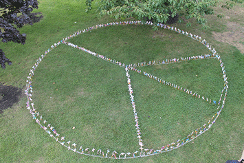  Students convey wishes for peace through pinwheels and prayers 