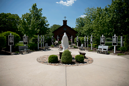 Restored Stations of the Cross enhances prayerful beauty to parish garden 