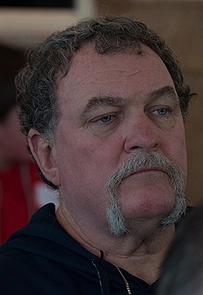 What are some of the challenges that Catholic men face in living out their faith?