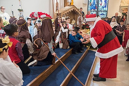 Young people retell Christmas story at Mass in St. Mary Church, Bordentown