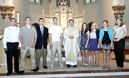 'Father Damian' honored for energy, enthusiasm he brings to parish family  