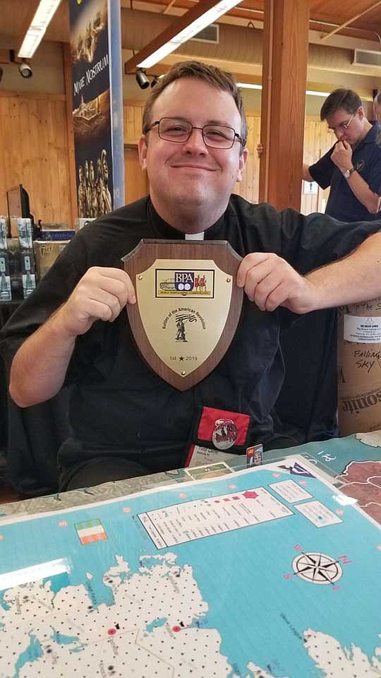 Father Carter wins board game tournament, shares hobby with parish