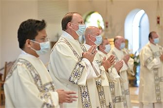 Six new deacons  poised for service after being ordained by Bishop O’Connell