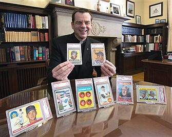 Priest plans to auction coveted baseball cards to aid low-income students