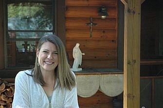 After adventures, young woman finds spiritual home in log cabin and church