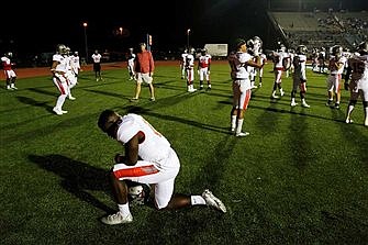 Supreme Court takes up former football coach's firing for praying on field