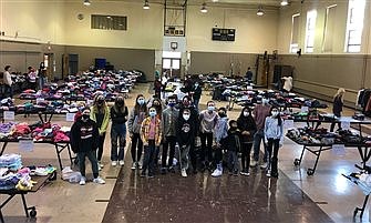 Youth join forces to run clothing giveaway for needy