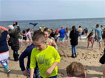 Cold Swimmers, Warm Hearts: Polar Plunge’s 16th year draws crowd for Catholic ed