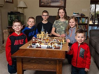 Siblings use Lego pieces to make scenes of parish church, other sites